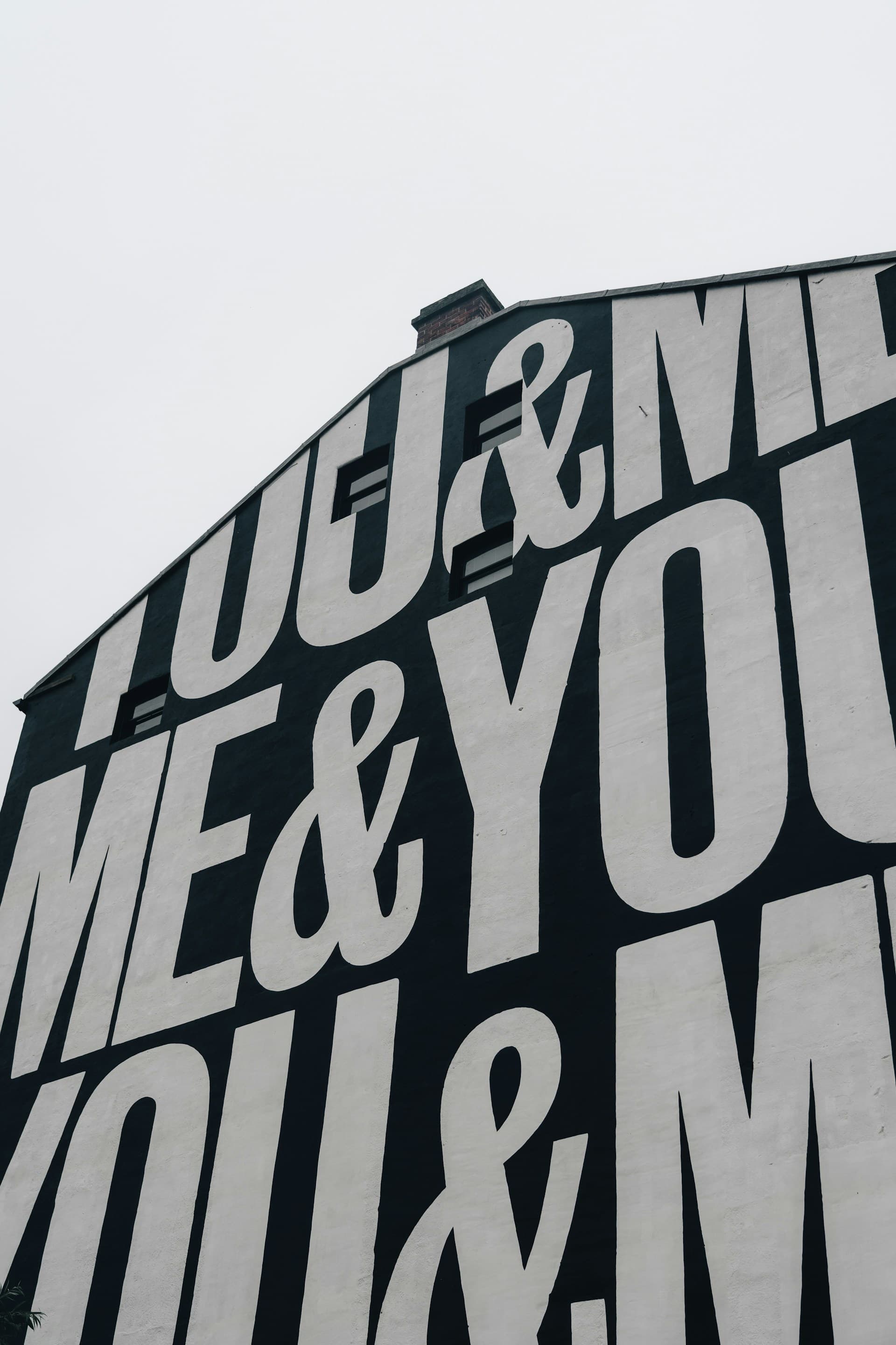 Large mural text reading you and me